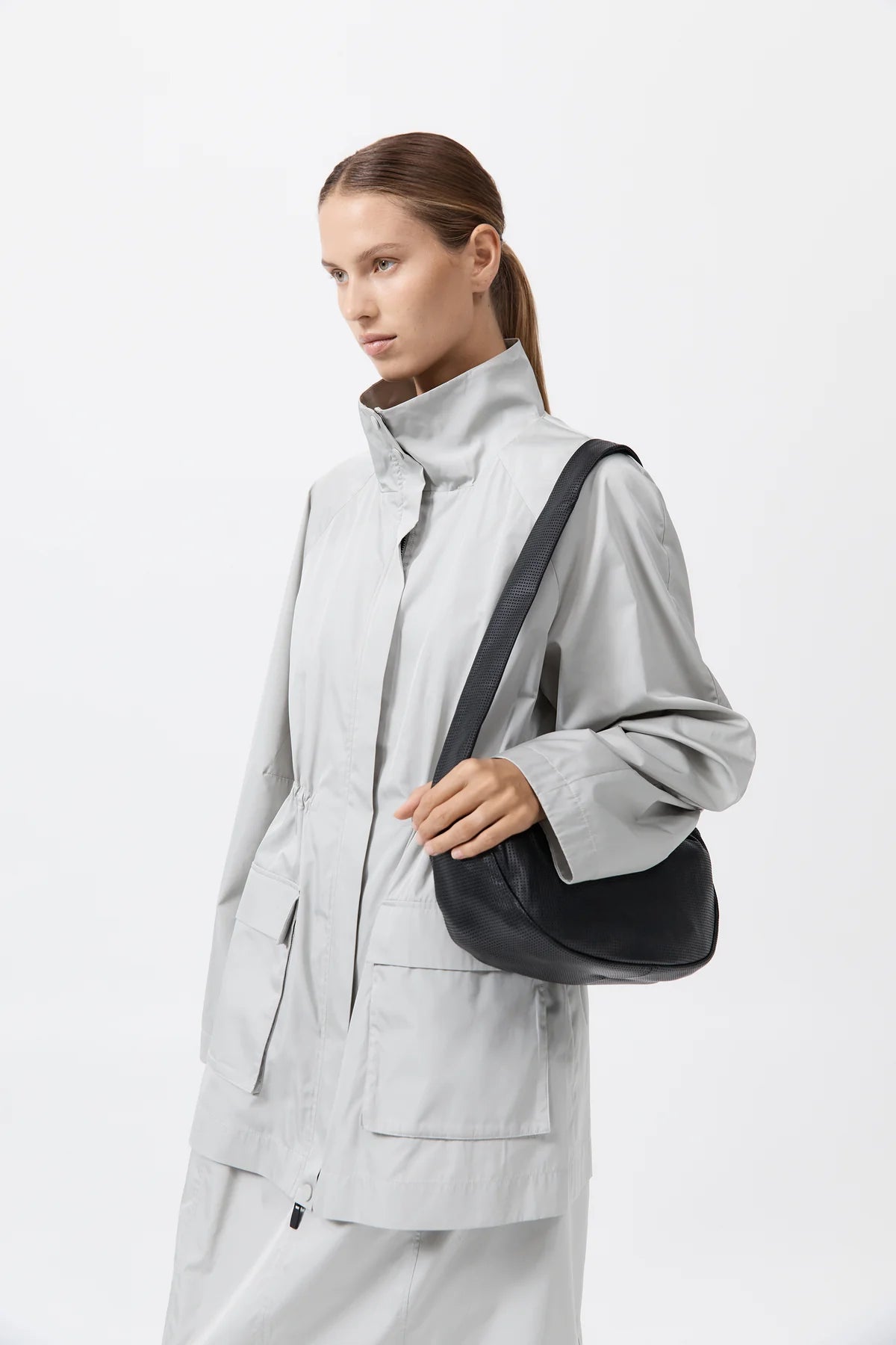 
                  
                    Perforated Crescent Bag
                  
                