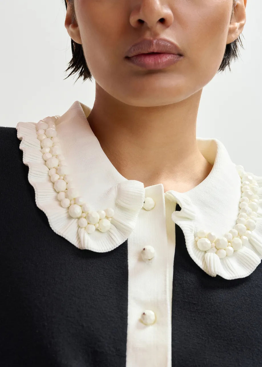 
                  
                    Jewelry Black And Off-White Ruffle Fine-Knit Polo Top
                  
                